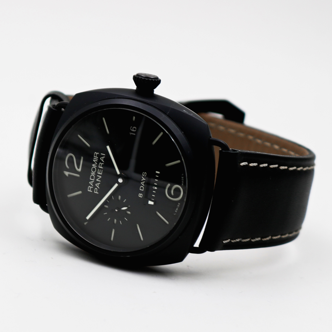 View of the Panerai Radiomir 8 Days watch lying on its side, displaying the black leather strap and case profile.